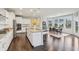 Bright and airy kitchen with large island, granite countertops, modern lighting, with an adjacent dining area at 3665 Conifer Dr, Zionsville, IN 46077