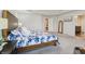 Beautiful main bedroom featuring tray ceiling, large windows and plush carpeting at 3665 Conifer Dr, Zionsville, IN 46077
