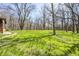Lush backyard features mature trees creating a private, park-like setting and green space at 3753 Whippoorwill Lake S Dr, Monrovia, IN 46157