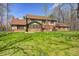 Expansive backyard showcases manicured lawn and wooded surroundings for serene outdoor living at 3753 Whippoorwill Lake S Dr, Monrovia, IN 46157