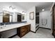 Bathroom featuring double sinks, vanity with storage, large mirror, and stylish tile at 3753 Whippoorwill Lake S Dr, Monrovia, IN 46157