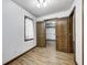 Bright bedroom features wood-look floors, light walls and bi-fold closet doors at 3753 Whippoorwill Lake S Dr, Monrovia, IN 46157