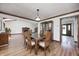 Dining room featuring a wood table, chairs, built-in cabinet, and access to other living spaces at 3753 Whippoorwill Lake S Dr, Monrovia, IN 46157