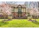 Inviting brick home with a covered entryway, complemented by well-maintained landscaping and decorative lighting at 3753 Whippoorwill Lake S Dr, Monrovia, IN 46157