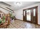 Warm foyer with detailed tile flooring and a grand wooden staircase, offering an elegant entrance at 3753 Whippoorwill Lake S Dr, Monrovia, IN 46157
