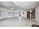 Spacious garage with built-in shelving, storage cabinets, and multiple access points at 3753 Whippoorwill Lake S Dr, Monrovia, IN 46157