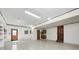 Spacious garage with ample storage space, shelving, and access doors at 3753 Whippoorwill Lake S Dr, Monrovia, IN 46157