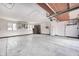 A spacious garage featuring an abundance of natural light and cabinet and shelf space at 3753 Whippoorwill Lake S Dr, Monrovia, IN 46157