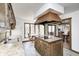 Bright eat-in kitchen features wood cabinets, cooktop island and breakfast nook with lots of natural light at 3753 Whippoorwill Lake S Dr, Monrovia, IN 46157