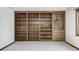 Spacious living room featuring built in shelving and a large picture window at 3753 Whippoorwill Lake S Dr, Monrovia, IN 46157