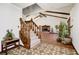 Inviting living room featuring a cozy fireplace, vaulted ceiling, and large windows, creating a comfortable space at 3753 Whippoorwill Lake S Dr, Monrovia, IN 46157