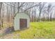 A shed with dark brown double doors, offers practical outdoor storage on the green lawn at 3753 Whippoorwill Lake S Dr, Monrovia, IN 46157