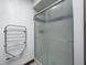 Bathroom featuring an enclosed standing shower with textured glass and chrome towel rack at 3753 Whippoorwill Lake S Dr, Monrovia, IN 46157