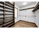 Walk-in closet featuring built-in shelving and hanging rods at 3753 Whippoorwill Lake S Dr, Monrovia, IN 46157