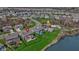Aerial view of a house near community amenities, a pool, and a pond at 419 Dovetree Dr, Danville, IN 46122