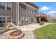 Backyard featuring a patio, outdoor seating, a fire pit, and play equipment on the grass at 419 Dovetree Dr, Danville, IN 46122