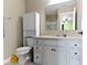 Bathroom features a large vanity, sink and a view into a bedroom at 419 Dovetree Dr, Danville, IN 46122