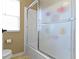 Bathroom with a frosted glass shower door, toilet, and blinds on a window at 419 Dovetree Dr, Danville, IN 46122