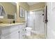Bathroom with a shower, toilet, vanity and mirror at 419 Dovetree Dr, Danville, IN 46122
