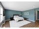 Comfortable bedroom with hardwood floors, bright windows and a soft white rug at 419 Dovetree Dr, Danville, IN 46122