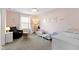 Cozy Bedroom with soft pink walls, a crib, and a comfortable sitting area at 419 Dovetree Dr, Danville, IN 46122