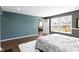 Comfortable bedroom features wood floors, two-tone paint and bright natural light from double window at 419 Dovetree Dr, Danville, IN 46122