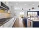 Gourmet kitchen with stone countertops, stainless steel appliances, and a breakfast nook nearby at 419 Dovetree Dr, Danville, IN 46122