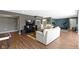 Relaxing living room area with hardwood floors, large TV and open layout at 419 Dovetree Dr, Danville, IN 46122