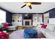 Cozy living room boasts a stone fireplace, built-in shelving, and comfortable seating at 419 Dovetree Dr, Danville, IN 46122