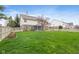 Sprawling backyard with lush green grass, a fence, and an inviting screened-in porch at 442 Athens Pl, Westfield, IN 46074