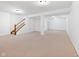 Carpeted basement includes staircase and large versatile space at 442 Athens Pl, Westfield, IN 46074