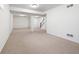 Finished basement with neutral carpet, white walls, and a staircase leading to the upper level at 442 Athens Pl, Westfield, IN 46074