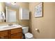Neutral half bath featuring a sink with wood cabinets and a modern toilet with an enclosed storage at 442 Athens Pl, Westfield, IN 46074