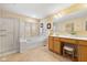 Bathroom featuring a large tub, separate shower, double sinks, and good natural light at 442 Athens Pl, Westfield, IN 46074