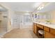 Bathroom featuring a large tub, separate shower, double sinks, and good natural light at 442 Athens Pl, Westfield, IN 46074