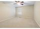 Bedroom features neutral carpet, a ceiling fan, and window allowing natural light at 442 Athens Pl, Westfield, IN 46074