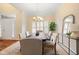 Inviting dining area featuring ample natural light, stylish furnishings, and hardwood floors at 442 Athens Pl, Westfield, IN 46074