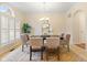 Formal dining room with a large window, decorative rug and classic chandelier at 442 Athens Pl, Westfield, IN 46074
