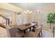 Dining room with elegant furniture, arched doorway, and ample natural light from large window at 442 Athens Pl, Westfield, IN 46074