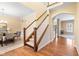 Bright and inviting foyer with hardwood floors, staircase, and views into the dining area at 442 Athens Pl, Westfield, IN 46074
