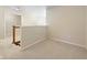 Bright hallway with neutral walls and carpet leading to an open space with light colored walls and carpet at 442 Athens Pl, Westfield, IN 46074
