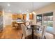 Eat-in kitchen featuring wood cabinets, stainless appliances, granite countertops, and sliding glass door to the deck at 442 Athens Pl, Westfield, IN 46074