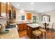 Well-equipped kitchen featuring an island with seating, granite countertops, stainless appliances, and hardwood floors at 442 Athens Pl, Westfield, IN 46074