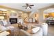 Inviting living room with fireplace, built-in shelves, and neutral decor that flows seamlessly to the kitchen at 442 Athens Pl, Westfield, IN 46074