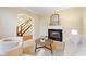 Inviting living space with fireplace, neutral tones, and comfortable seating arrangement at 442 Athens Pl, Westfield, IN 46074