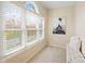 Cozy office space with a large window, blinds, and an arched window, and a comfy bench seat at 442 Athens Pl, Westfield, IN 46074