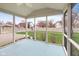 Cozy screened porch with blue flooring and backyard view at 442 Athens Pl, Westfield, IN 46074