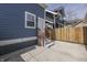 The backyard includes a small patio area and a wood fence at 451 N Gray St, Indianapolis, IN 46201