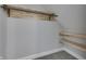 Angled closet featuring a hanging bar and two shelves for storage and organization at 451 N Gray St, Indianapolis, IN 46201