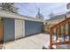 View of the backyard featuring a one car garage, wood fence, and concrete patio at 451 N Gray St, Indianapolis, IN 46201